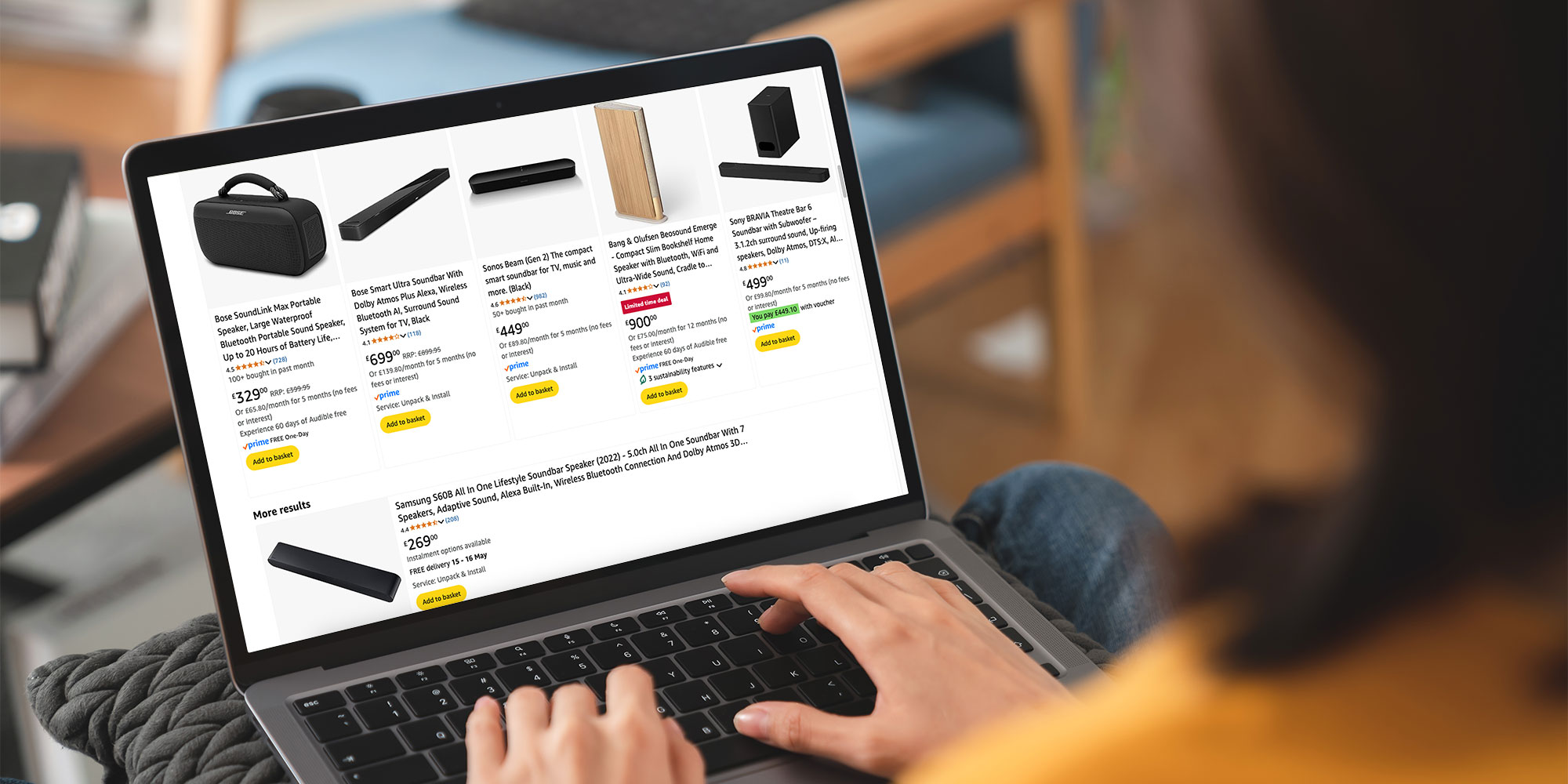 Someone shopping for a soundbar on their laptop