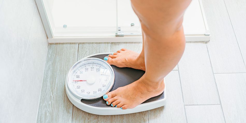 Person standing on bathroom scales