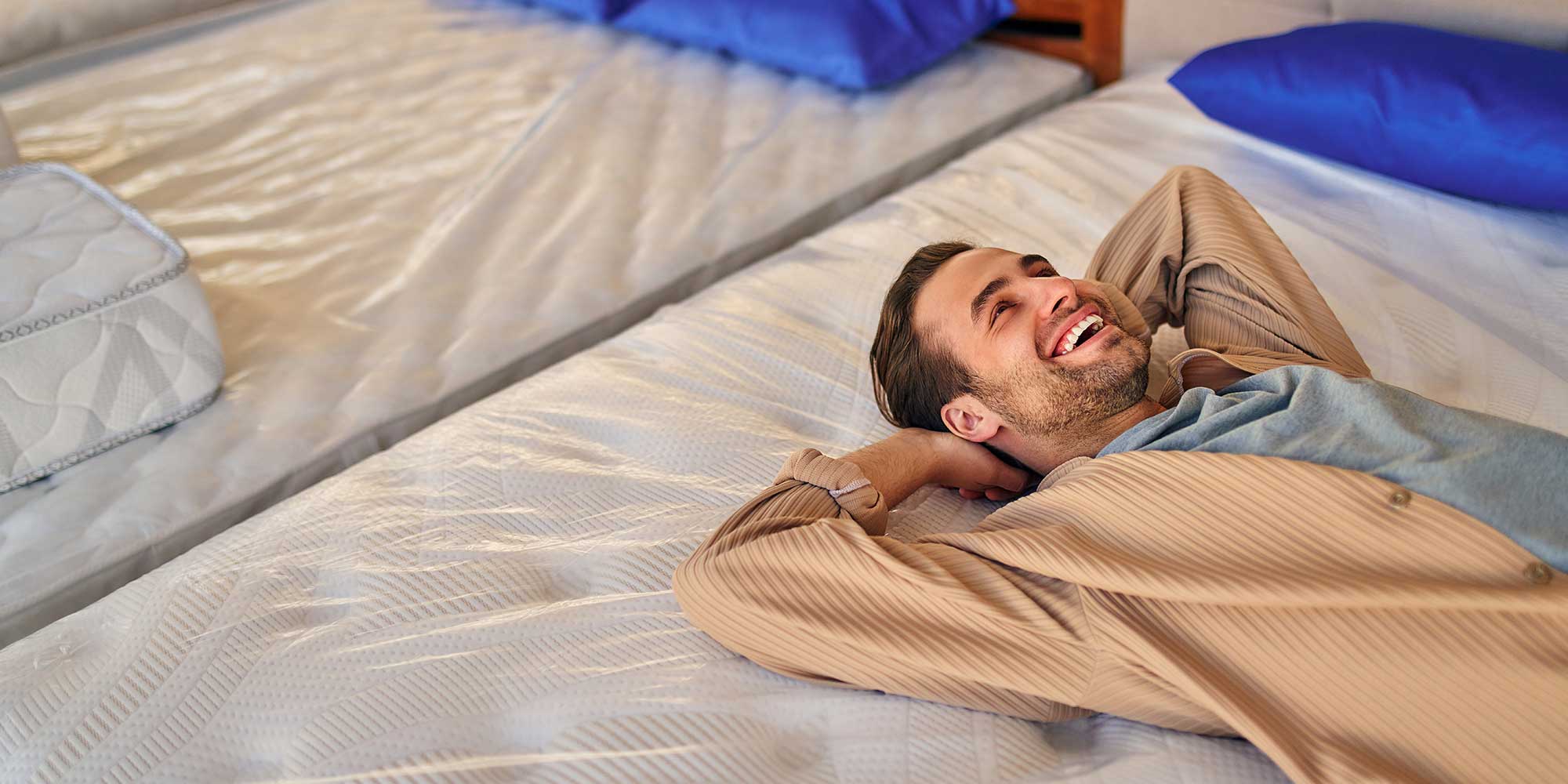 Person testing a mattress in store