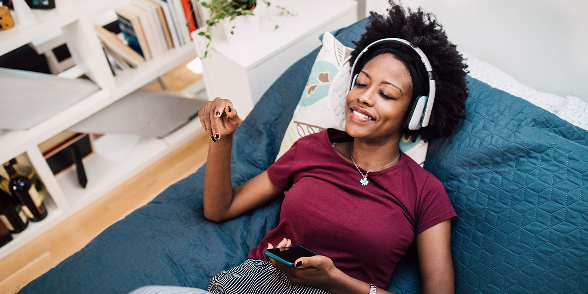 A man listens to music through headphones