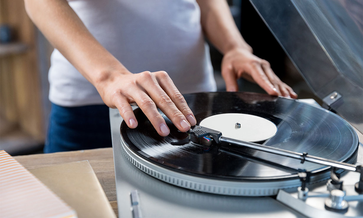 Person playing vinyl