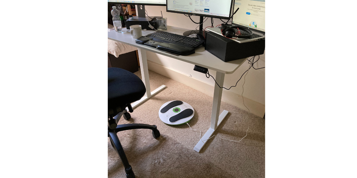 desk set up with a circulation booster device underneath