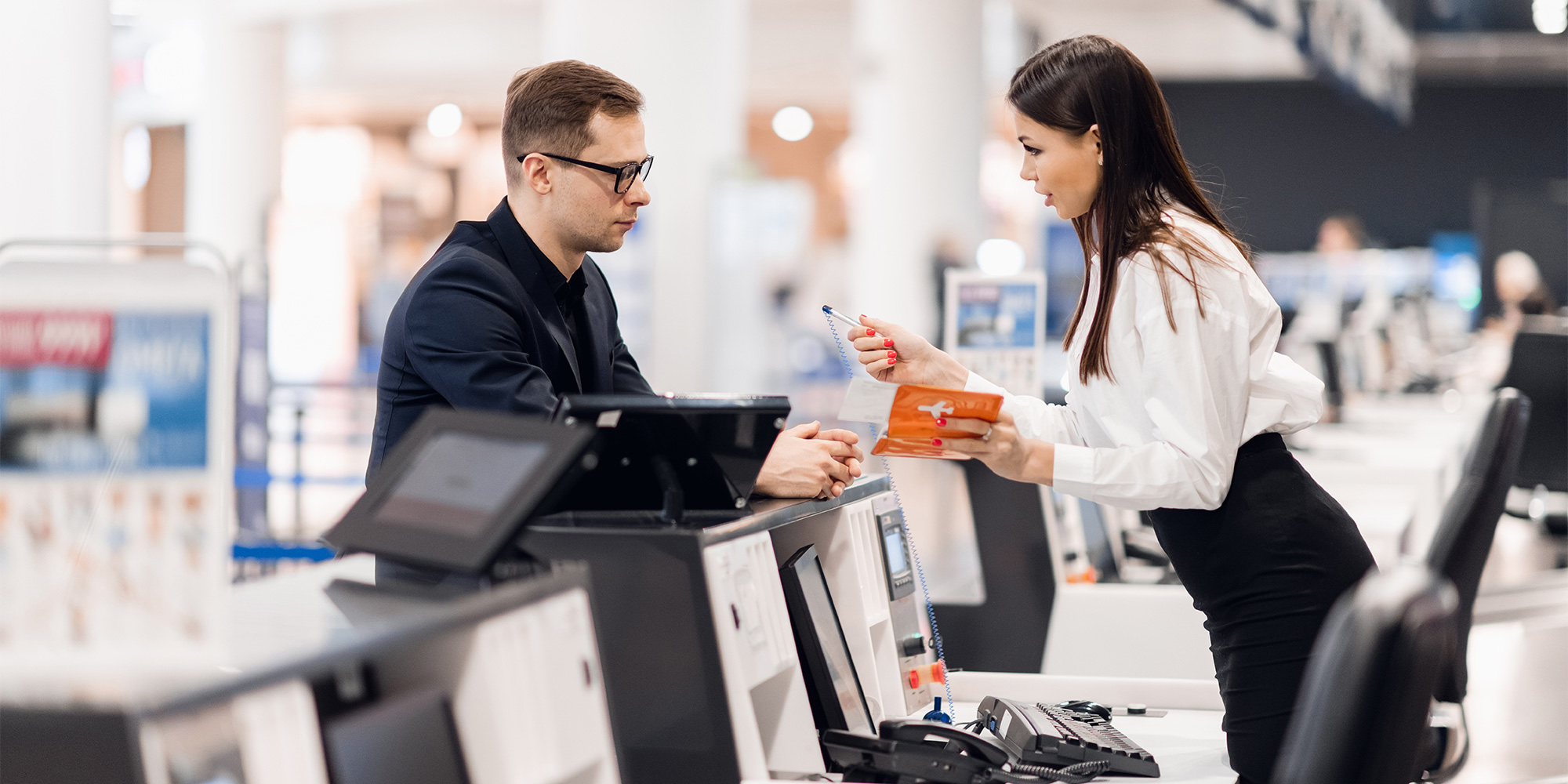 A conversation at an airline check-in desk